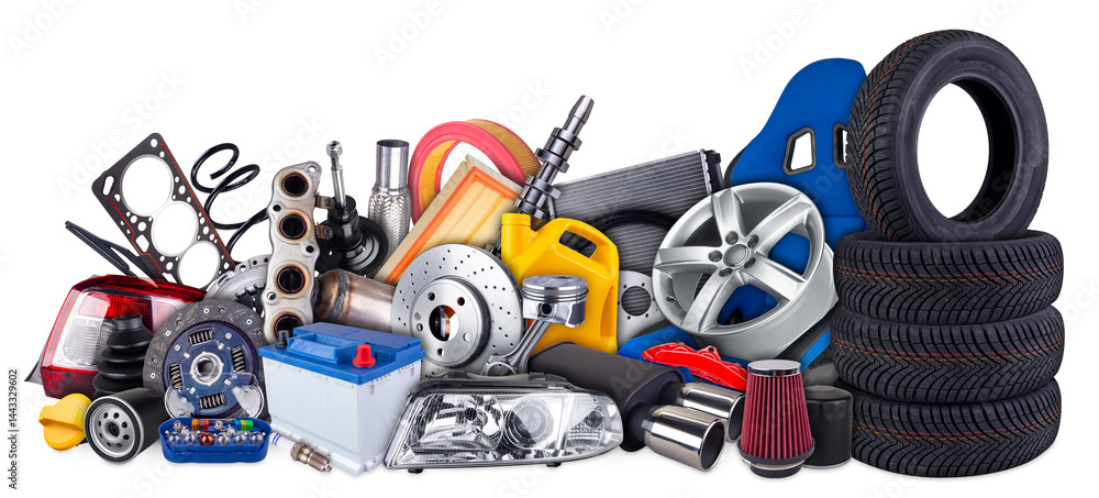 huge stack pile of car parts including seat wheels, tires, filters, and engine components isolated white background. automotive vehicle repair and service industry concept.