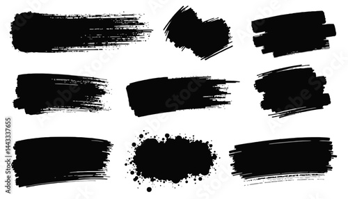 Brush Strokes in Bold Black: A collection of graphic brush strokes. Each mark, an interplay of texture and form, stands out in bold black