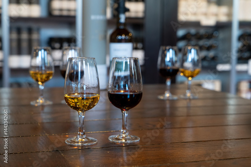 Obraz na płótnie port wine testing, glasses with drink samples in bar w salonie