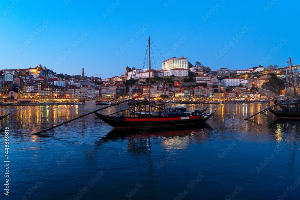 Fototapeta premium Picturesque, colorful view at old town Porto at sunset over Douro river. Oporto, touristic mediterranean city