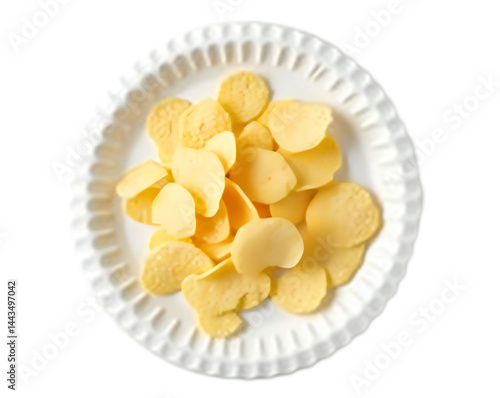 Top-Down, High-Contrast Image of a White Plate with Small, Round, Light Yellow Snacks, Perfect for Illustrating Snacks, Treats, or Appetizers in Food Photography or Design Projects