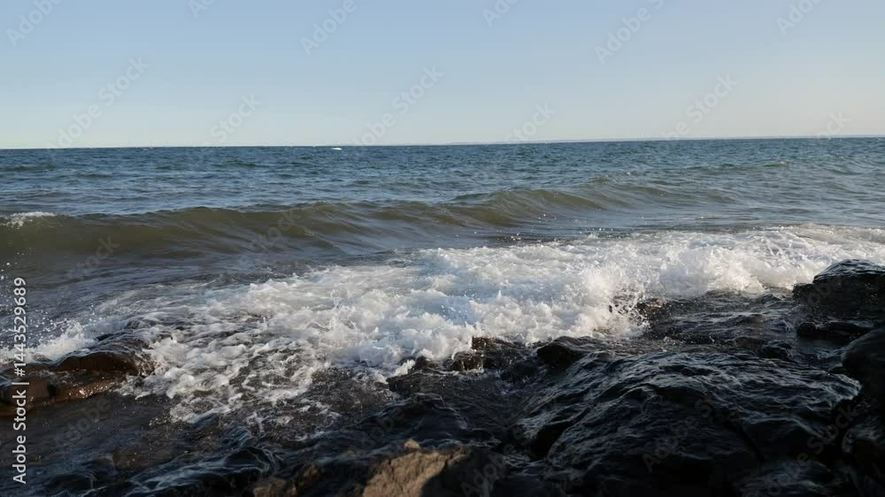 Large waves crashing into rocky beach at sunset, Lake Superior, Duluth, Minnesota, United States, 4K Large waves crashing into rocky beach at sunset, Lake Superior, Duluth, Minnesota, United States, 4K