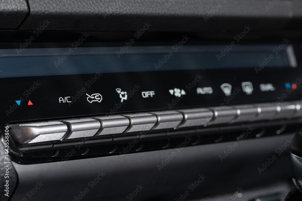 Panel with buttons to control ac in car