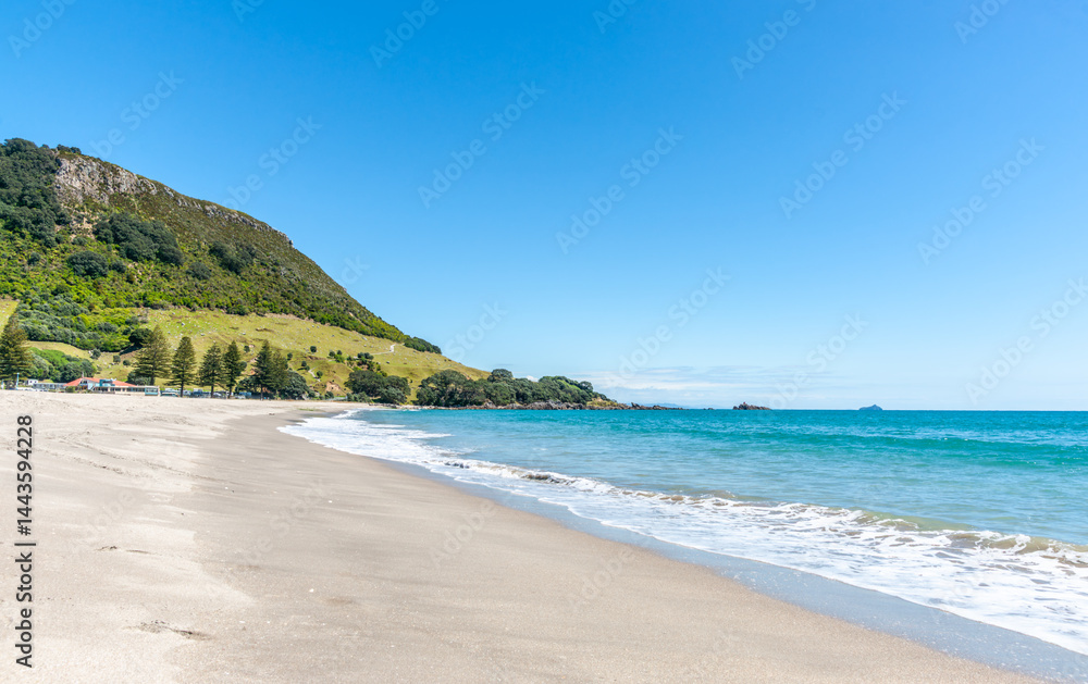 Long sandy Main Beach leading to Mount Maunganui