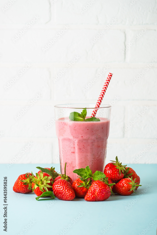 Strawberry smoothie or milkshake on white.