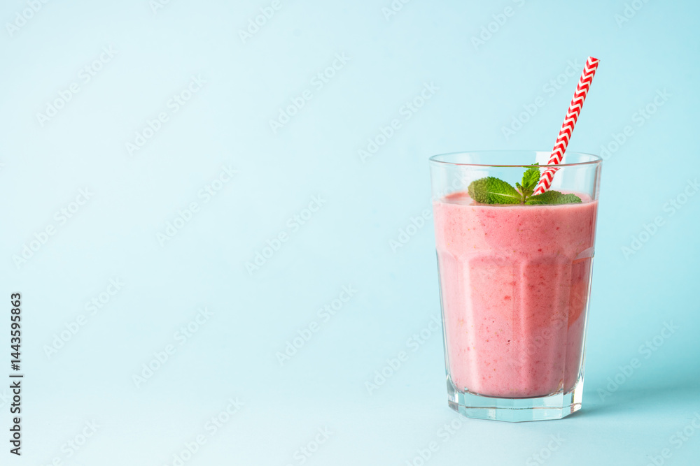 Strawberry smoothie or milkshake on white.