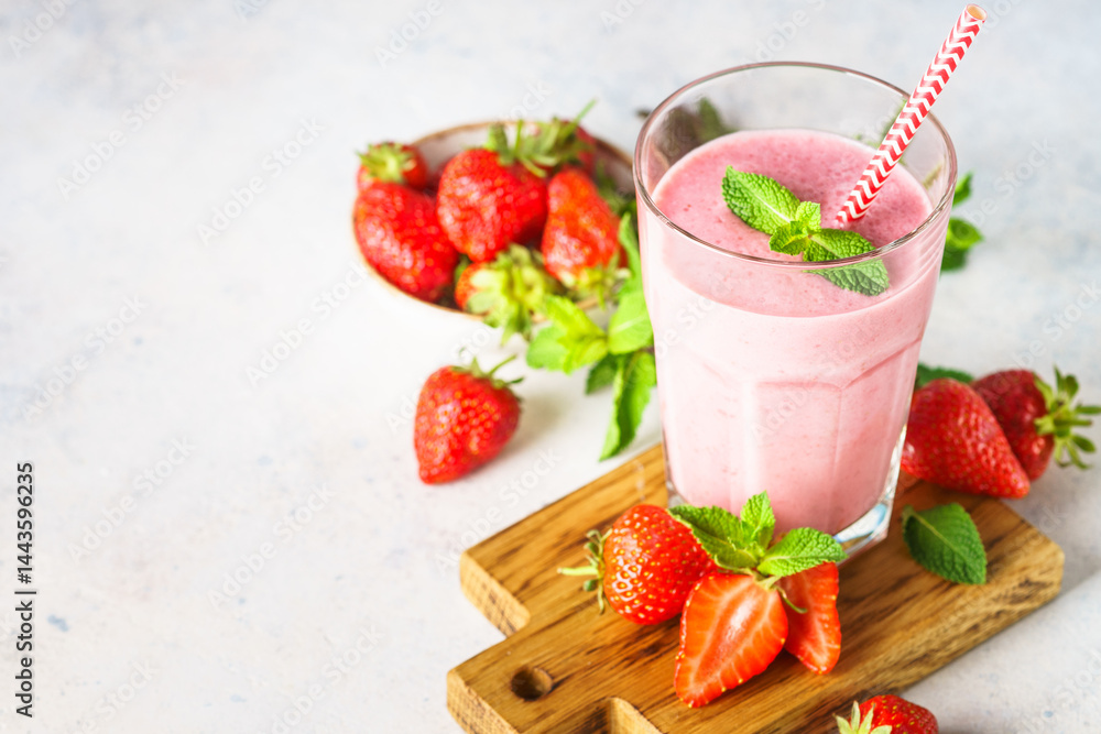 Strawberry smoothie or milkshake on white.