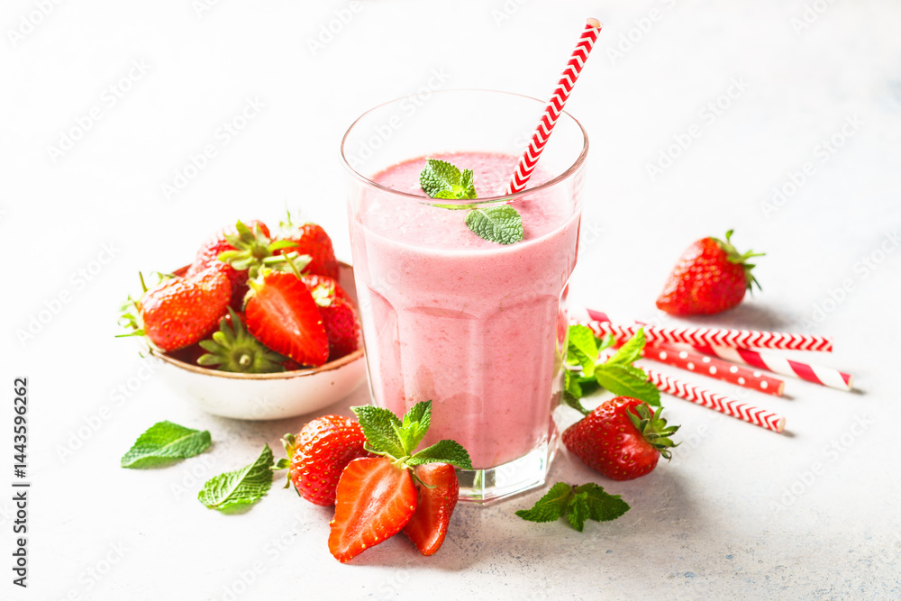 Strawberry smoothie or milkshake on white.