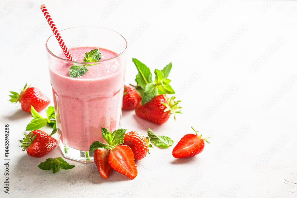 Strawberry smoothie or milkshake on white.