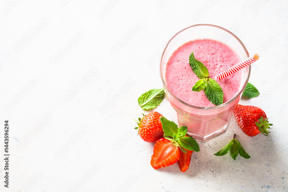 Strawberry smoothie or milkshake on white.