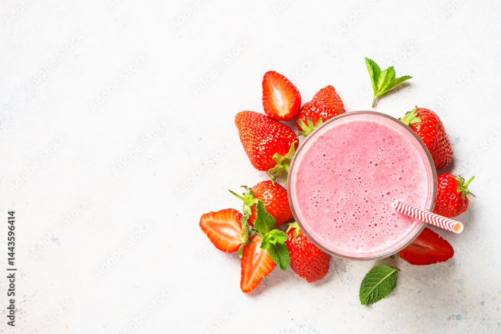 Strawberry smoothie or milkshake on white.