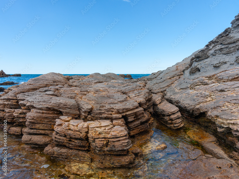 Weathered rocks and rock-pools at base of Mount Maunganui