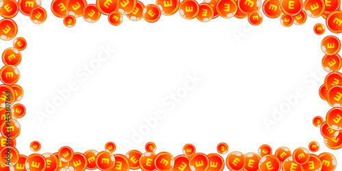 Vitamin E round capsules scattered randomly.