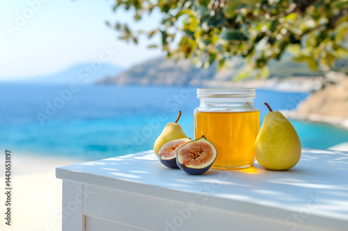 Ripe figs, pears and honey on an outdoor table with a beautiful seashore in the background