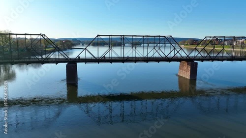 Amazing 4K aerial footage captured by drone showcases the historic bridges spanning the Susquehanna River in Harrisburg, Pennsylvania. Filmed on April 28, 2025