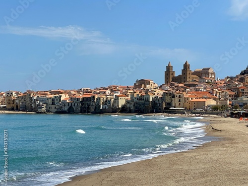 Beach and cityscape with Norman cathedral, Cefalu, Palermo, Sicily, Italy