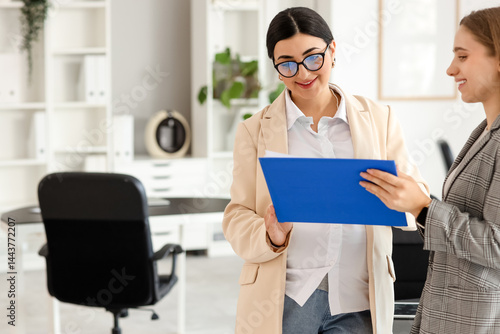 Pregnant businesswoman work...