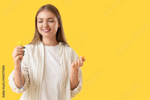 Young woman with ear plugs ...