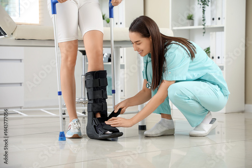 Young woman with broken leg...