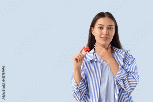 Young Asian woman with thyr...