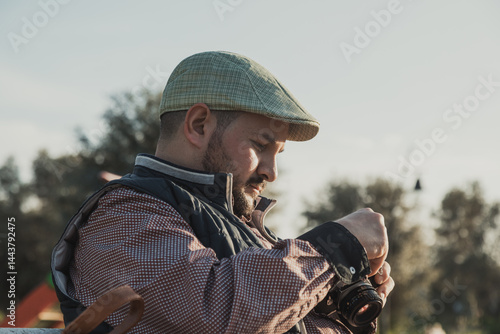 Photographer Checking The Film Inside The Vintage Camera 