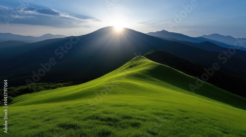 Sunrise over rolling green hills