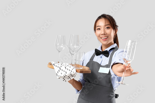 Young Asian smiling waitres...