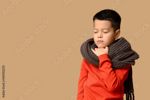 Ill little Asian boy with s...