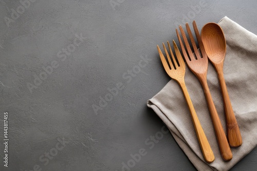 Obraz na płótnie Wooden spoon and forks on linen cloth rustic kitchenware culinary utensils w salonie