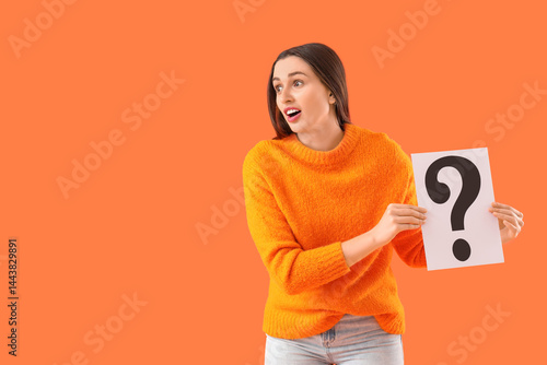 Young woman with paper ques...