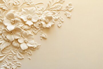 Ornate floral relief sculpture design on a light beige background.