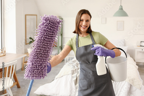 Female janitor with mop and...