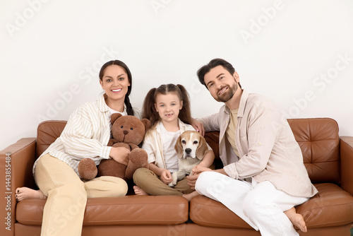 Happy family with Beagle do...