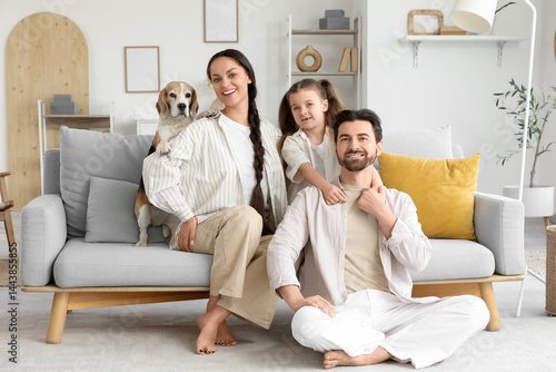 Happy family with beagle do...