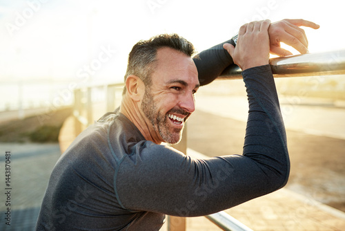 Obraz na płótnie Happy, running and man in morning rest for exercise, marathon training and cardio workout in town. Sports, sunshine and person for wellness, health and recovery for performance, endurance and fitness w salonie