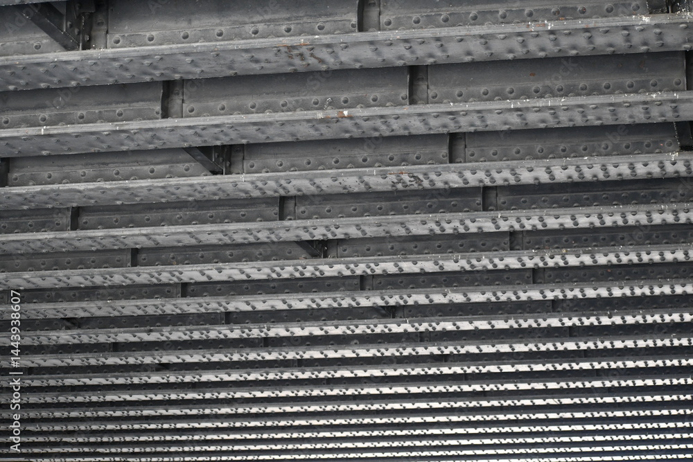Steel girders in linear pattern. Underside of highway bridge. Steel girders in linear pattern. Underside of highway bridge.