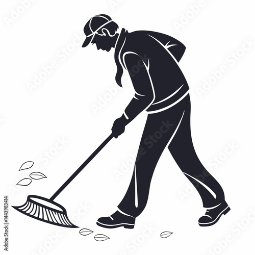 Silhouette Of A Man Sweeping Leaves With A Broom Outdoors