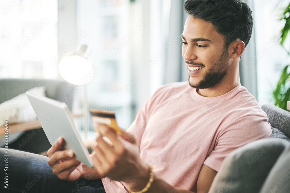 Credit card, sofa and man on tablet for online shopping, internet purchase and payment in home. Ecommerce, fintech and person on digital tech for website sale, subscription sign up and banking app Credit card, sofa and man on tablet for online shopping, internet purchase and payment in home. Ecommerce, fintech and person on digital tech for website sale, subscription sign up and banking app