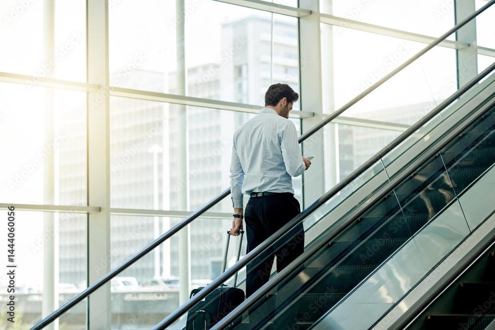 Escalator, airport and businessman with phone for travel, commute and arrival in lobby for trip. Conference, professional and person on electric stairs on smartphone for schedule and flight info Escalator, airport and businessman with phone for travel, commute and arrival in lobby for trip. Conference, professional and person on electric stairs on smartphone for schedule and flight info