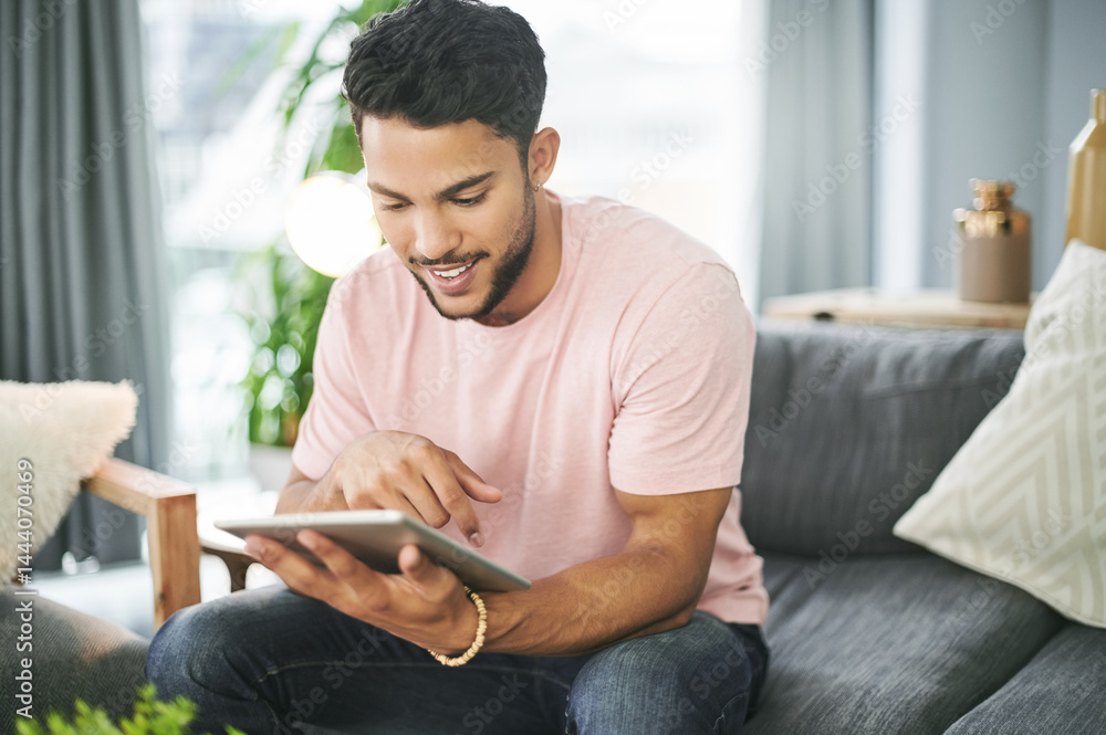 Happy man, sofa or browsing decor with tablet for furniture, new interior or DIY tips in living room at home. Casual, male person or user scrolling on technology with smile for online store or design