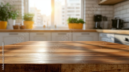 Close-up view of a polished wooden table surface with blurred sunlit kitchen background showcasing white cabinets and a window with city views and light