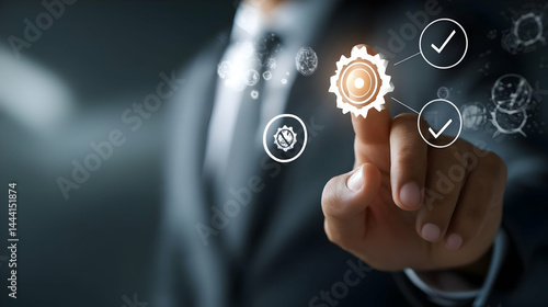 Businessperson interacts with a digital gear system.