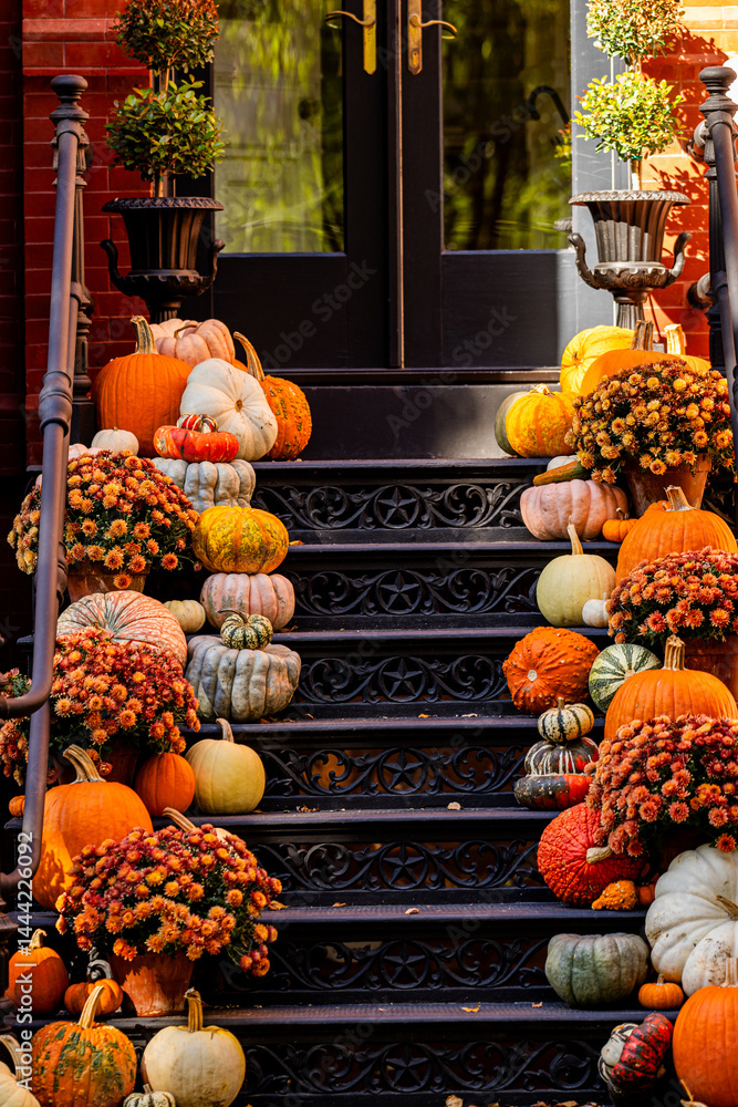 Halloween pumpkin decorations. Pumpkin for decorated house. Halloween Decorated at front yard of a American home. Halloween decorated front door with pumpkins. Autumn holiday of Halloween.