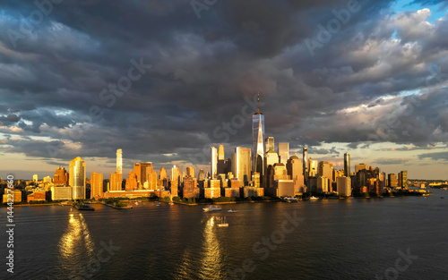Obraz na płótnie Manhattan aerial skyline, New York. Panorama view of New York city skyscrapers on dramatic sky. USA NYC. Lower NYC skyline on sunset. New York cityscape. New York City with clouds from drone. w salonie