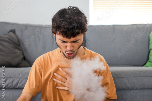 Fotografie Male smoker suffering from chronic cough during smoking