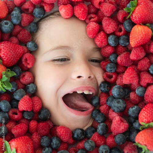 Obraz na płótnie Fruits set. Mix of berries. Kids face with fresh berries fruits. Assorted mix of berries strawberry, blueberry, raspberry, blackberry on background. Healthy nutrition berries for kids. w salonie
