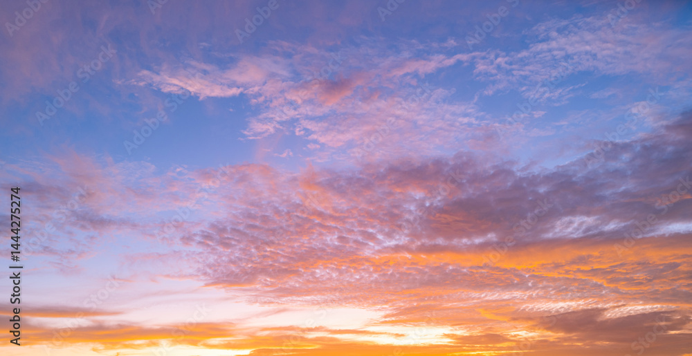 Sky at sunset. Sunrise background. Sunset through clouds on sky. Twilight sky with sunset colors. Peaceful dawn with soft light. Dramatic dusk sunset with clouds. Sunshine in clear sky.