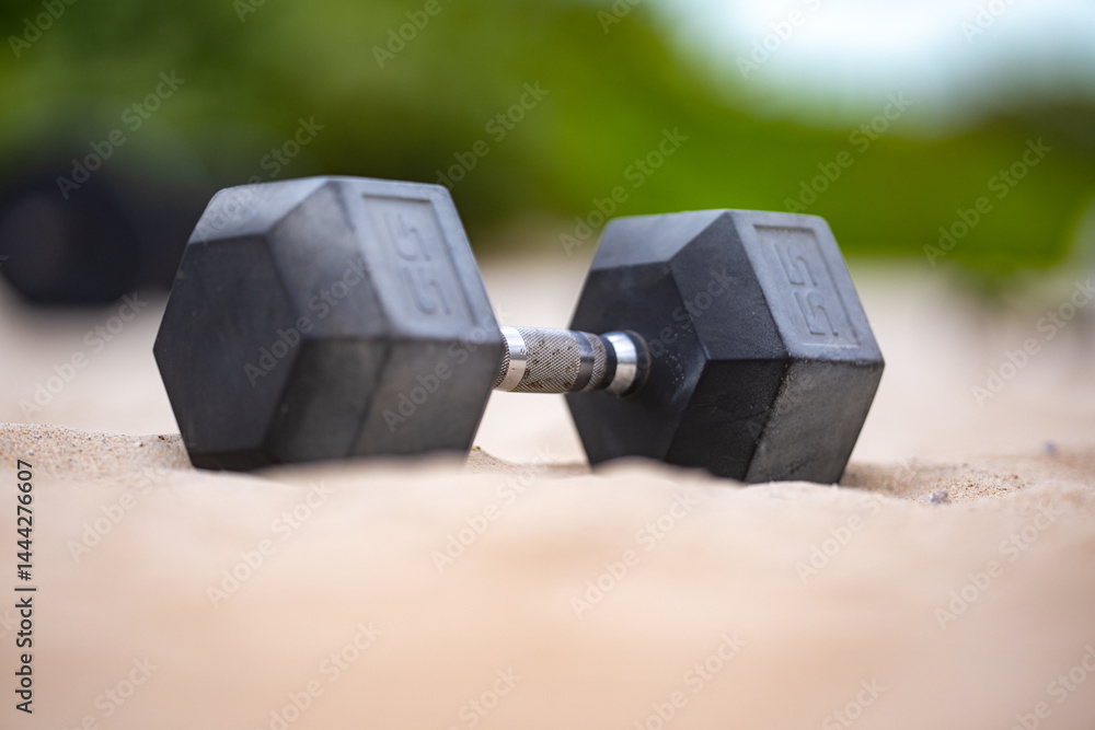 Dumbbells sport. Dumbbells background. Dumbbell on the beach for summer sport. Dumbbells in sand. Workout with dumbbells. Healthy lifestyle background. Sport banner with dumbbell.