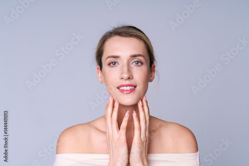 Obraz na płótnie A woman in a relaxed pose symbolizes the concept of spa treatments, relaxation and self-care. Natural beauty, serenity and care w salonie