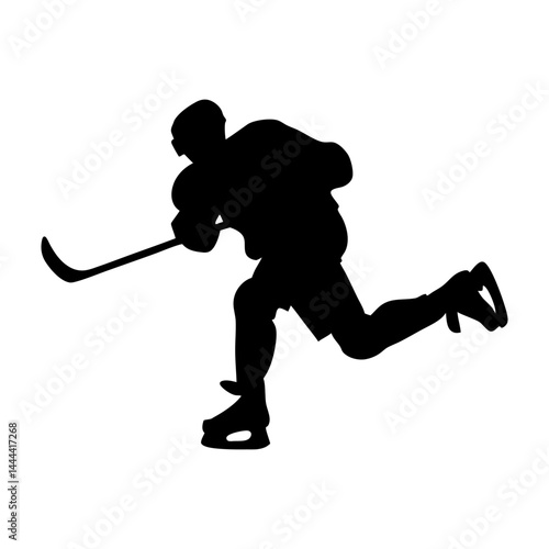 Silhouette of hockey player skating with stick during game